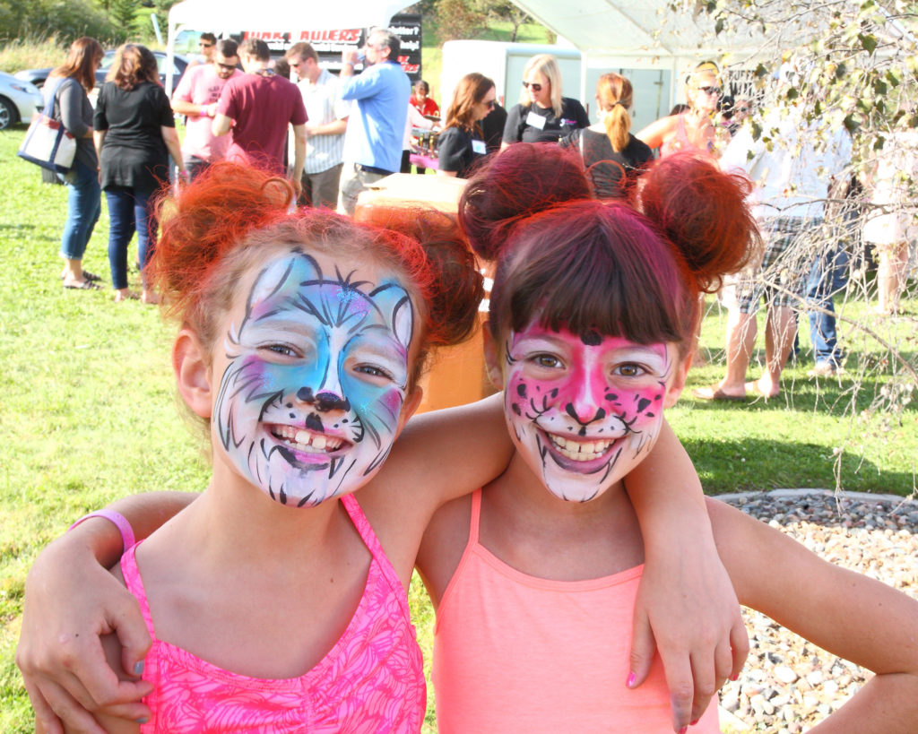 two girls with crazy hair and face paint